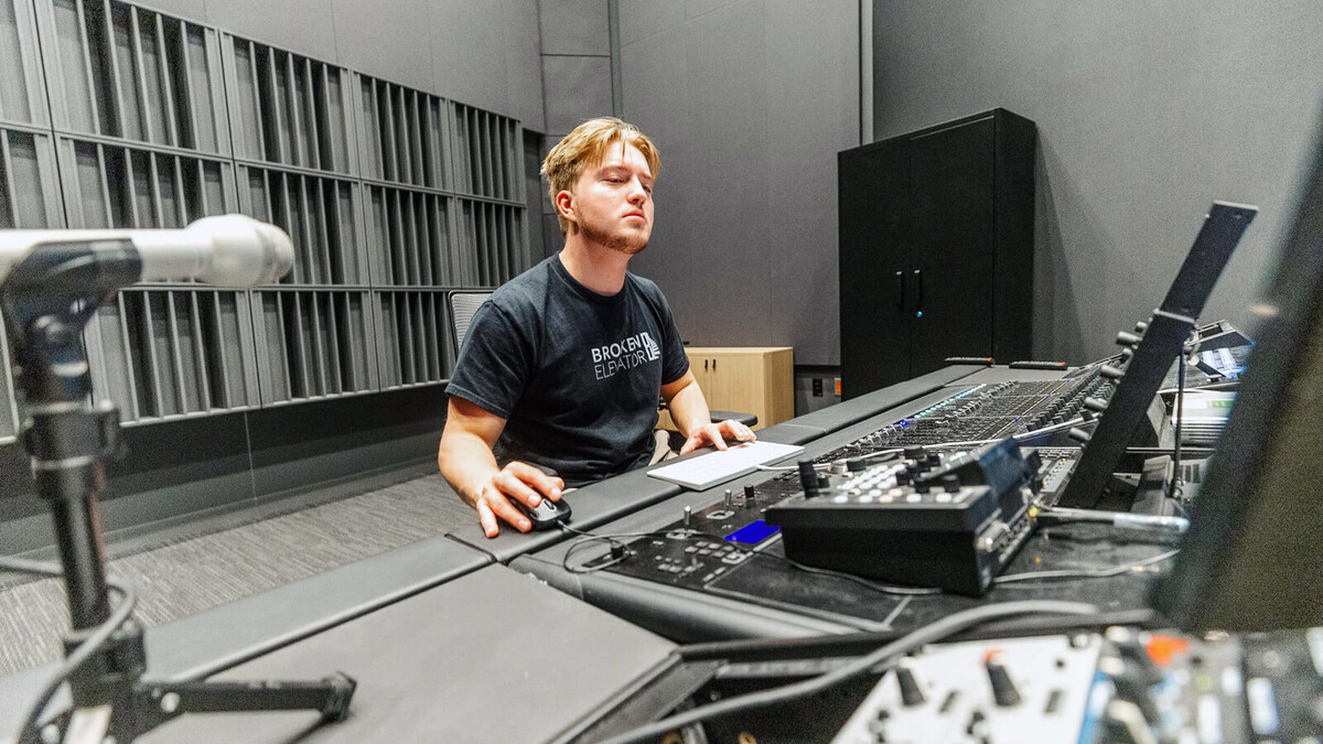 James Rasser, a vocal performance major, works at the mixing desk in the studio inside the Westbrook Music Building. Students in the Advanced Audio Recording and Production course used the new studio to record a four-song EP with local band Joyrager.