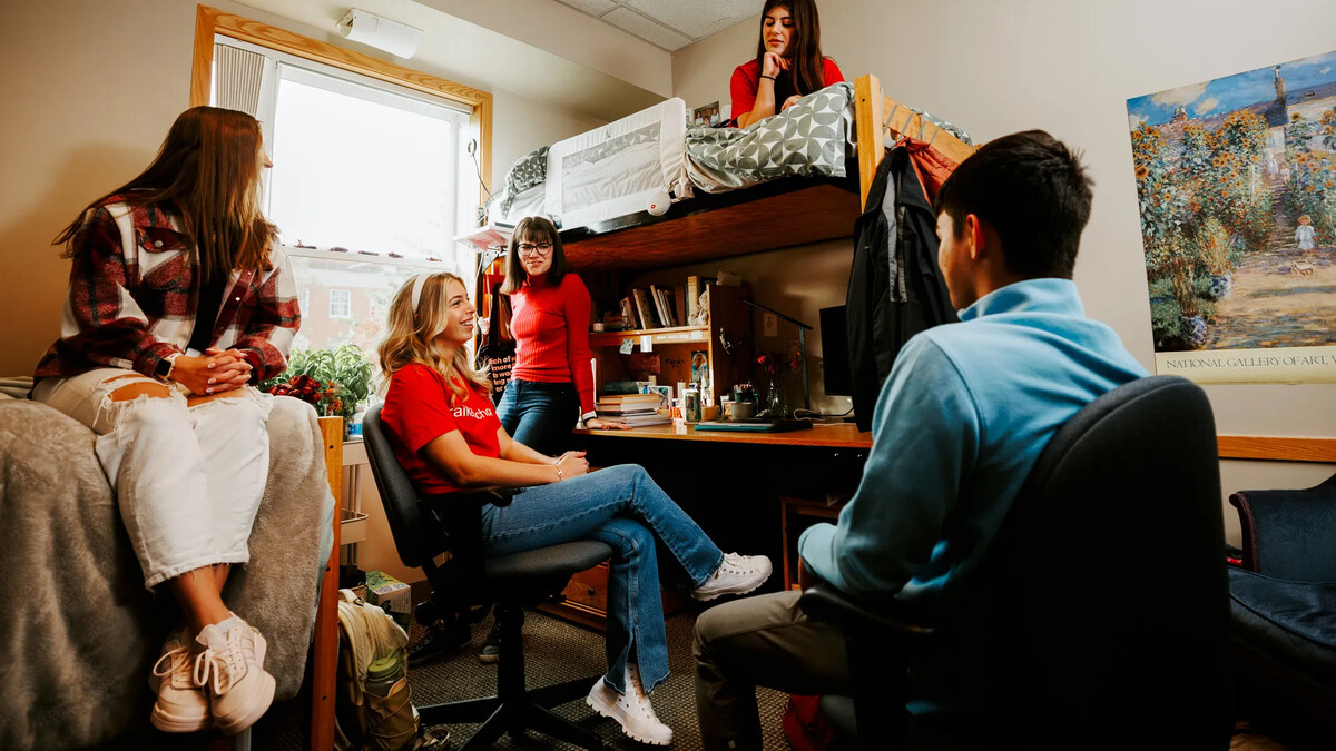 Students hanging out in a residence hall room.