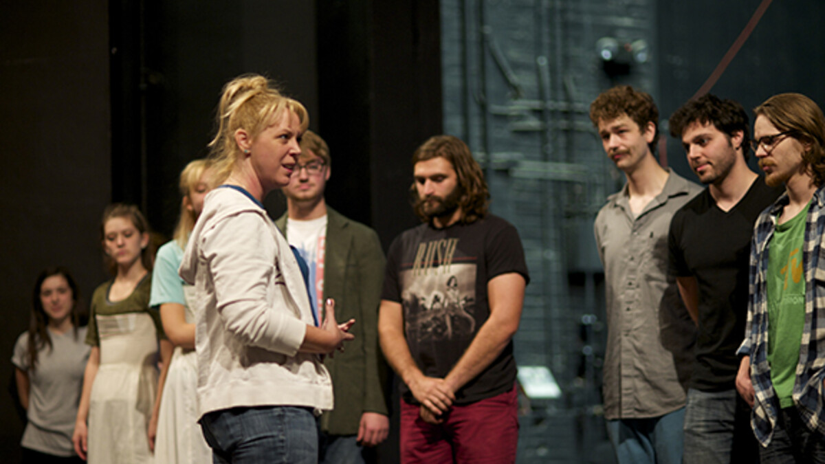 Guest Director Melora Kordos (front) visits with her cast during a rehearsal for "Love's Labor's Lost," which opens Nov. 13.