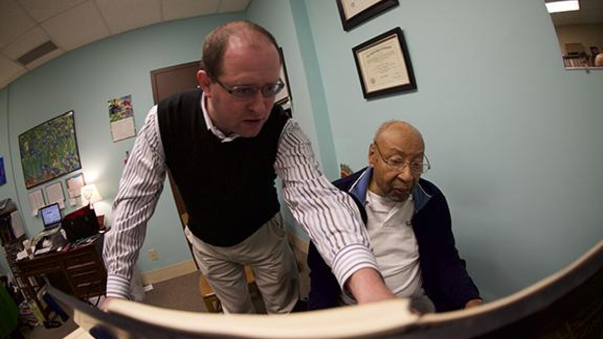 Pianist Denis Plutalov asks a question of composer Robert Owens during Owens’ visit to UNL in March. Photo by Michael Reinmiller.