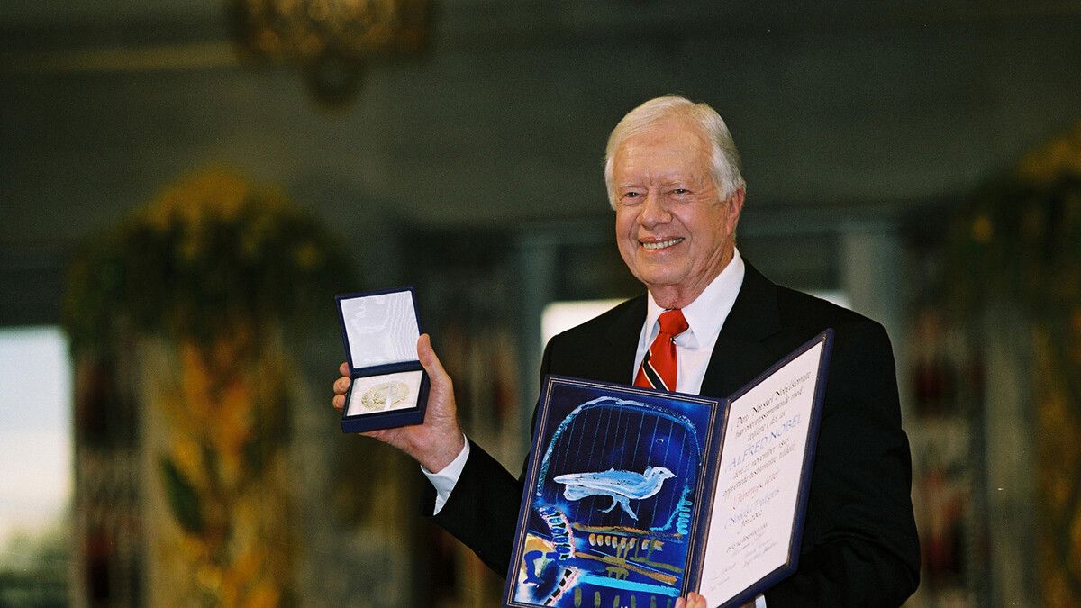 President Jimmy Carter holds the Nobel Peace Prize during the award ceremony on Dec. 10, 2002 in Oslo, Norway.