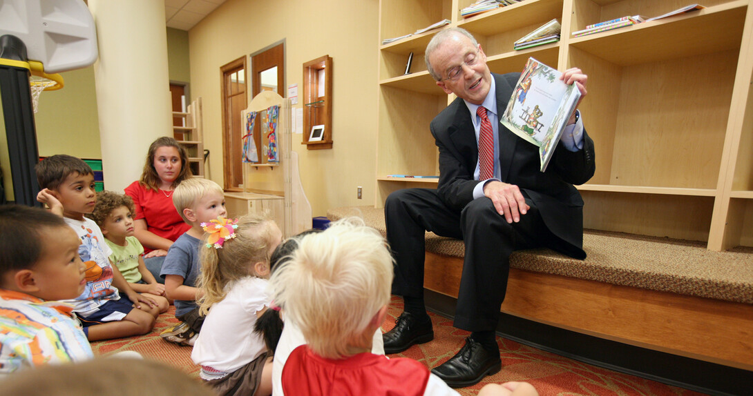 Chancellor Harvey Perlman reads a book to youth at the UNL Children's Center. The UNL Children's Center has earned accreditation from the National Association for the Education of Youth Children.