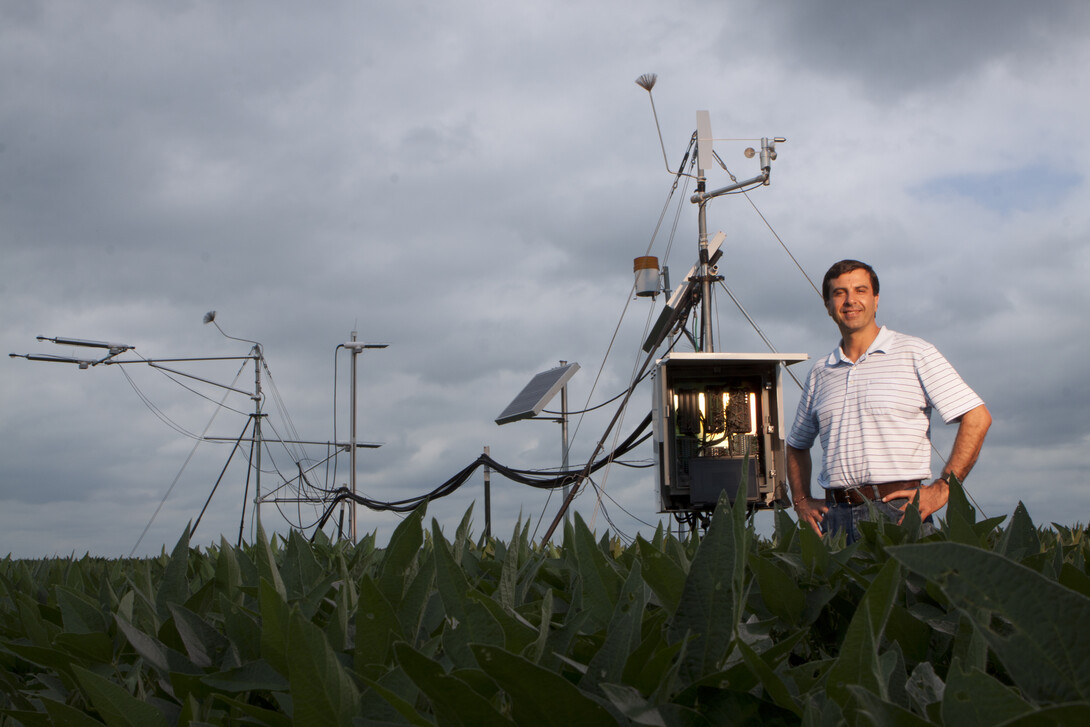 Irmak in the field with evaporative water loss measurement systems.