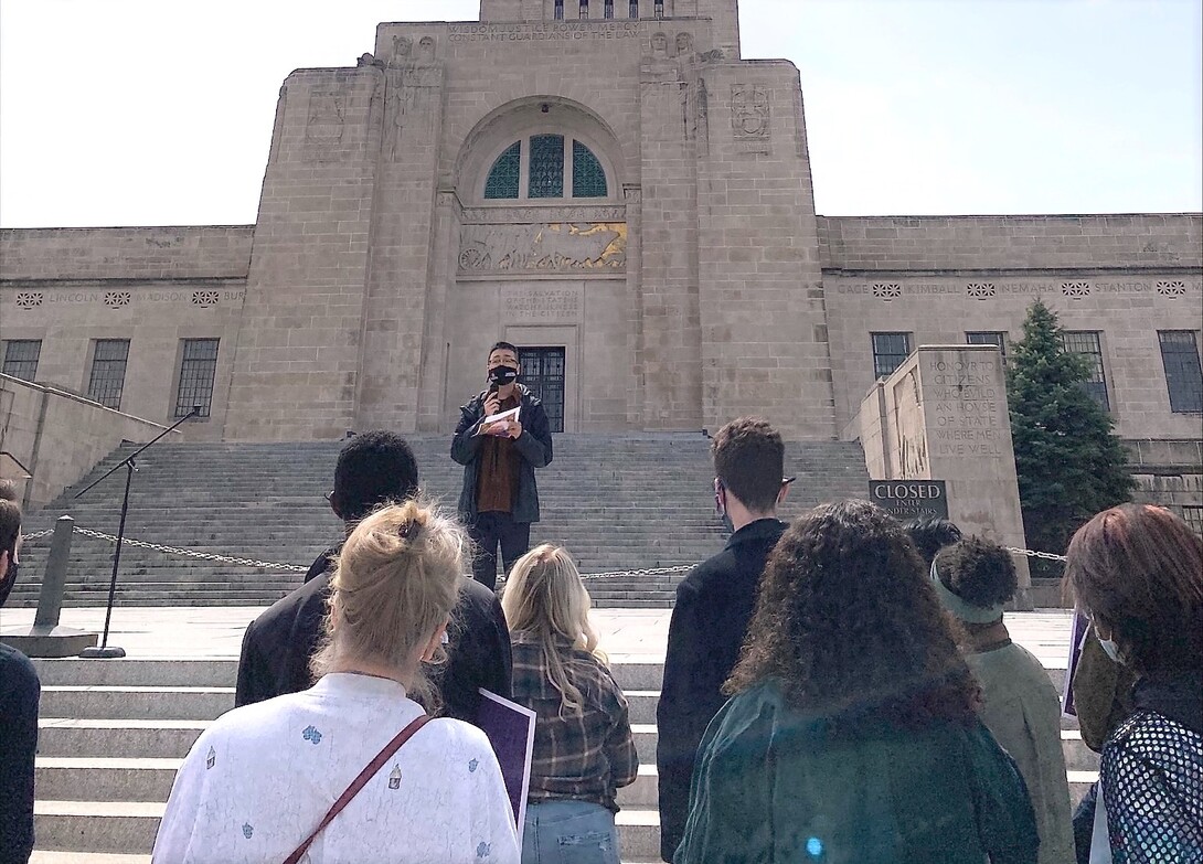 Zhou speaks at a rally outside the Nebraska State Capitol.