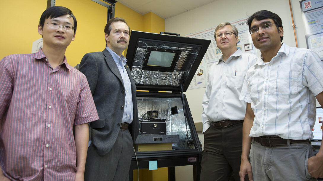 (From left) Haidong Lu, postdoctoral researcher; Alexei Gruverman, professor of physics and astronomy; Evgeny Tsymbal, professor of physics and astronomy; and Tula R. Paudel, research assistant professor. The scientists are affiliated with the Nebraska Center for Materials and Nanoscience. Tsymbal is director of the NSF-supported Materials Research Science and Engineering Center at UNL.  