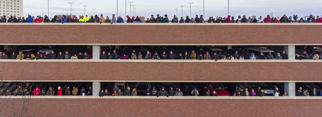 People line up to watch the Cather-Pound implosion from a parking garage at 19th and Vine streets. Hundreds showed up to view the razing.