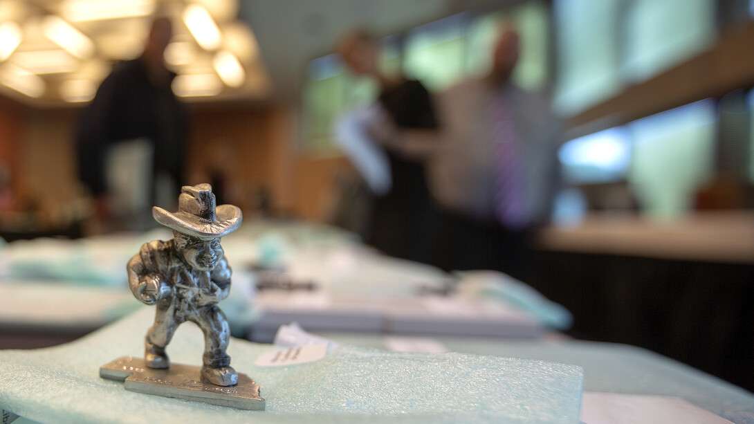 A pewter Herbie Husker, which is a five-year Service Award option, awaits a pickup prior to the start of the Celebration of Service.