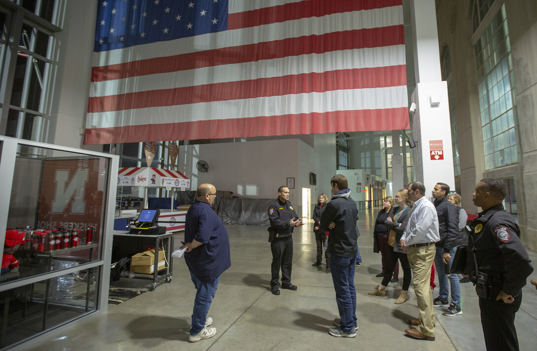 Captain John Backer (second from left) leads a behind-the-scenes security tour of Memorial Stadium during the fourth week of UPD's Citizens' Police Academy on Oct. 10.