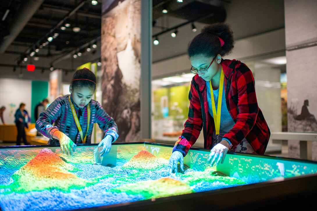 Visitors enjoy a preview visit to the new Cherish Nebraska exhibit in February 2019.