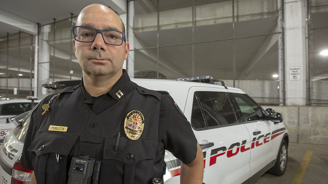 Capt. Aaron Pembleton is among the University Police officers wearing new badges that celebrate the 150th anniversary of Dear Old Nebraska U. The badges will be work through February 2019.