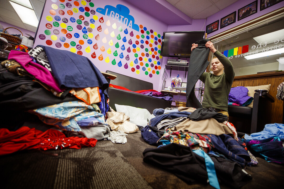 Will Jackson, senior in psychology from Waverly, sorts donations at the resource center. 