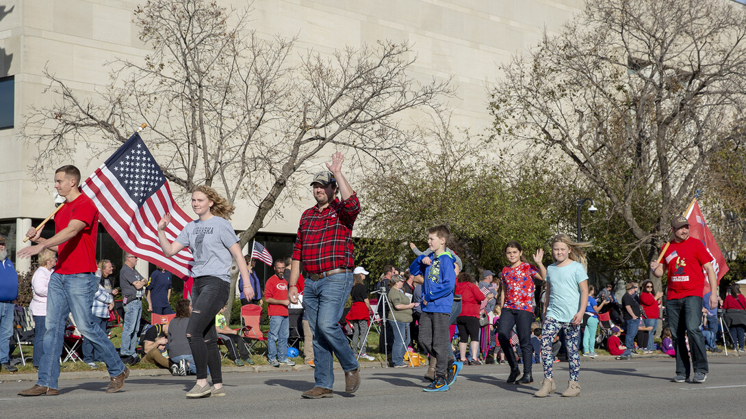 Members and supporters of the University of Nebraska–Lincoln Student Veteran Organization march in the Lincoln Veterans Parade on Nov. 9. The RSO has partnered with the University of Iowa to raise awareness about veteran suicide.