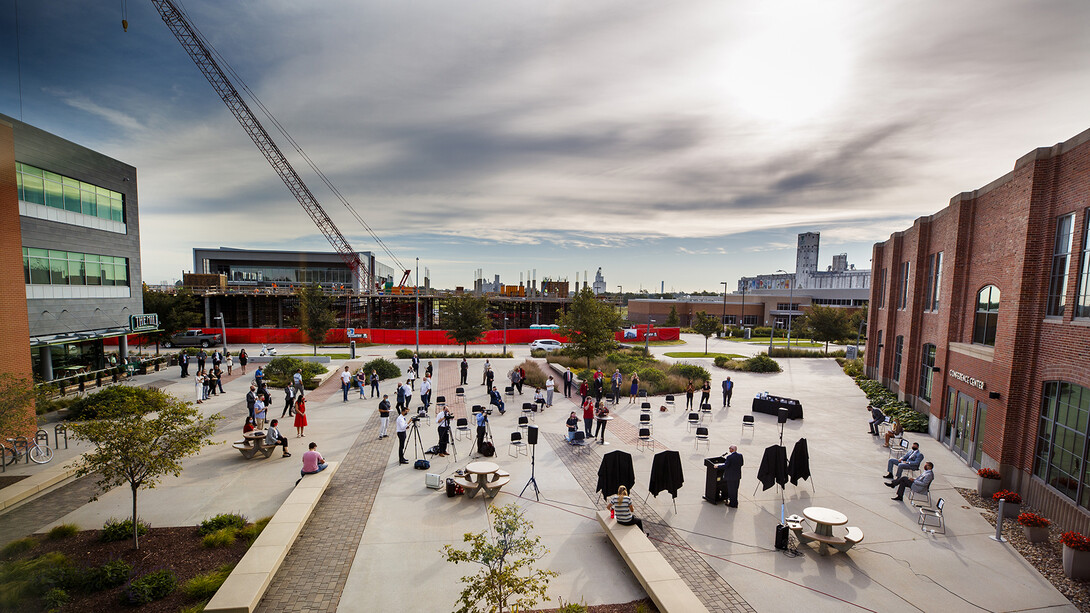 The Scarlet Hotel announcement, which observed social distancing guidelines, was held Aug. 18 at Nebraska Innovation Campus. The hotel (pictured under construction in the background) is scheduled to open in 2021.