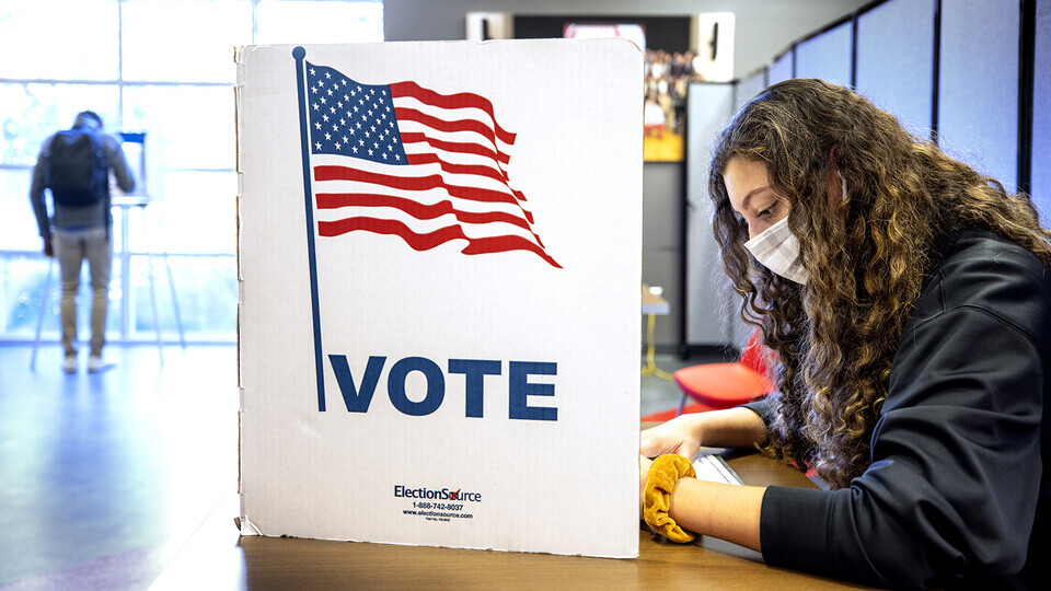 Grace Carey, a freshman from Bellevue, Nebraska, votes in her first election Nov. 3, 2020.