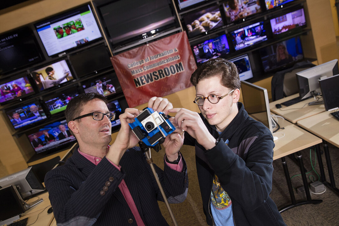 Matt Waite, left, professor of practice in UNL's College of Journalism and Mass Communications, and Tony Papousek, a senior journalism major from Clarkson, created a 360 video of the Beatrice 77 sale barn during a live auction.