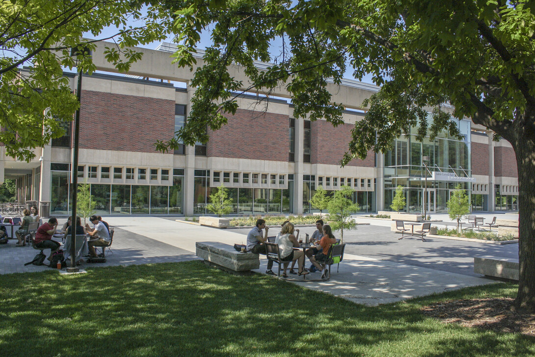 Students studying outside Adele Hall Learning Commons.