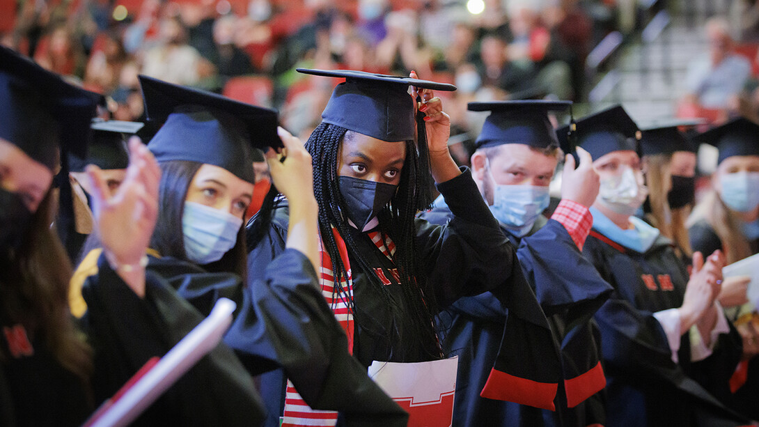 Jasmine Alexander moves the tassel on her graduation cap at the end of the graduate and professional degree ceremony Dec. 17 at Pinnacle Bank Arena. She earned a Master of Arts.