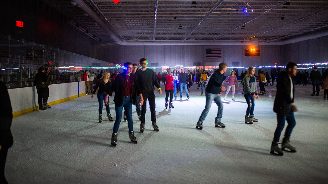 Husker students skate at the John Breslow Ice Hockey Center during a Glow Big Red event in February 2020. Campus Recreation hosts free open skating on select Friday and Saturday nights at the Breslow Center.