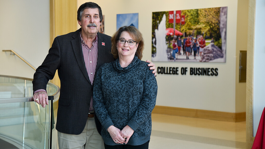 Paul and Mary Ann Koehler pose near a staircase in Howard L. Hawks Hall.