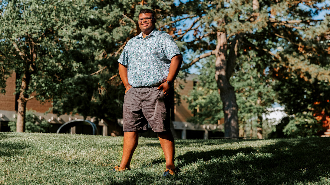 Nebraska's Jayven Brandt stands outside in the Sheldon Sculpture Garden.