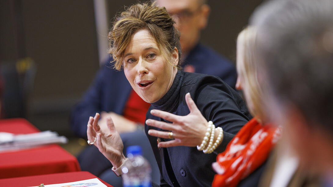 Tiffany Heng-Moss gestures during a discussion with university leaders.