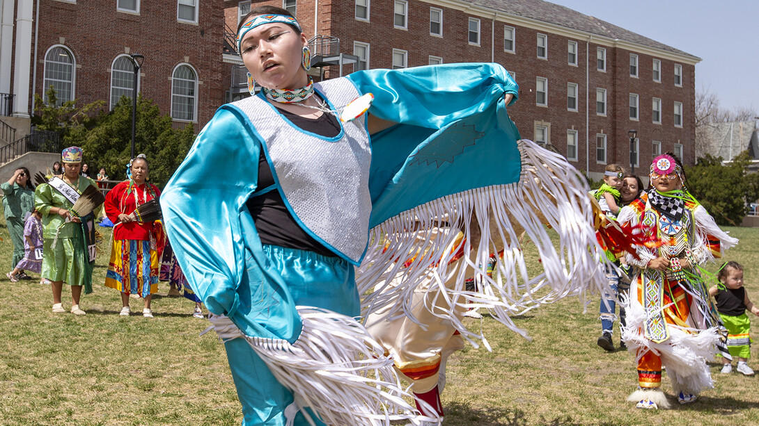 A young woman dances during an intertribal moment at the April 23 powwow.