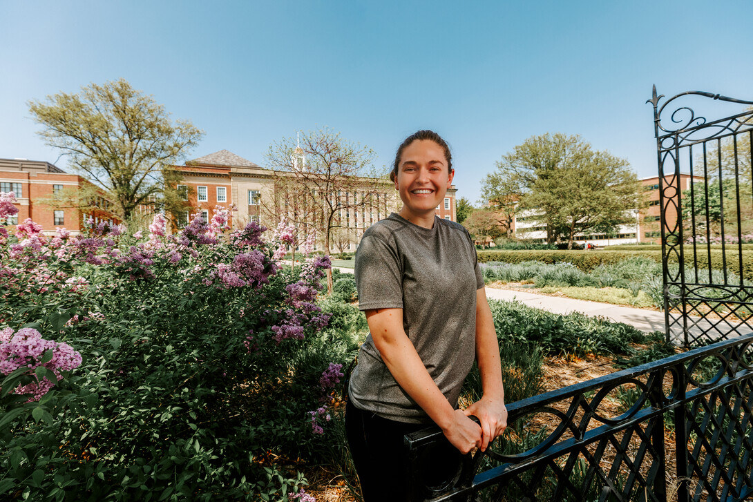 Taylor smiles for a photo outside Love Library