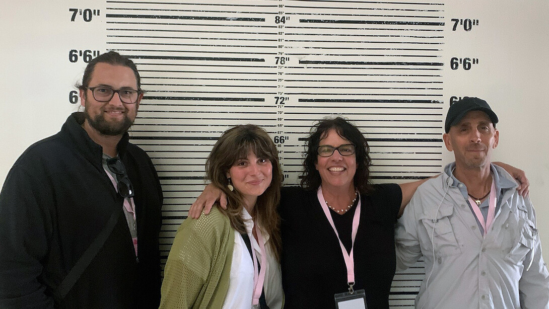 Nebraska's Alex Gordon-Stotz (left) stands with art department colleagues while on set of the "Barbie" movie.