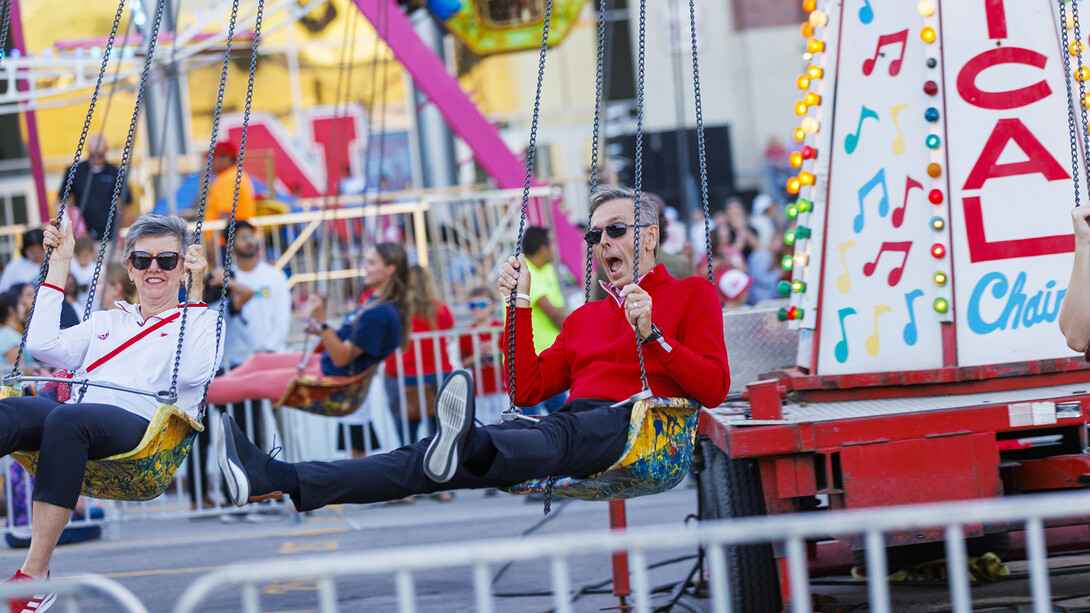 Chancellor Ronnie Green and his wife, Jane, enjoy a ride during homecoming on Sept. 30, 2022.