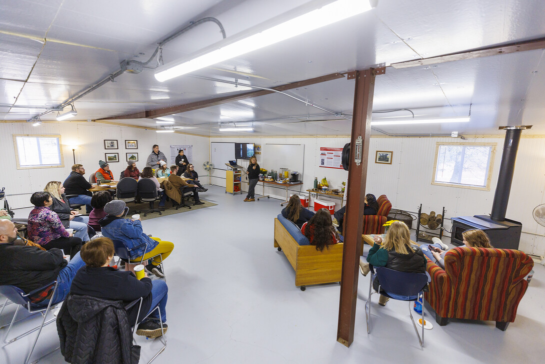 Sophia Perdikaris describes the Reller Praire to a group of counselors. The interior of the metal building has been remodeled into an attractive learning space.