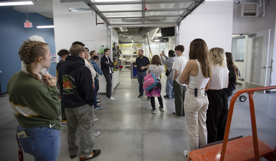 Jerry Reif (center) speaks with Bay High students outside the woodshop in Nebraska innovation Studio Oct. 20, 2022.