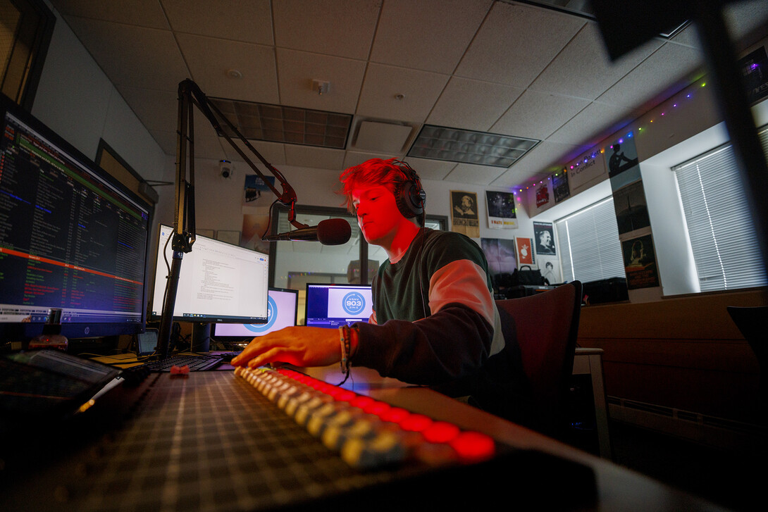 Ryan Luetkemeyer, a sophomore from St. Louis, does the afternoon broadcast from the booth at KRNU. November 9, 2022.