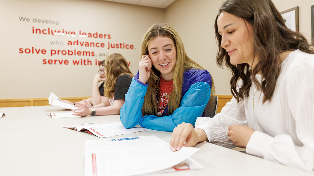Heather Haratsis (second from right) studies with a fellow law student. One of the strengths of the Nebraska Law program is the camaraderie between students and faculty, she said.