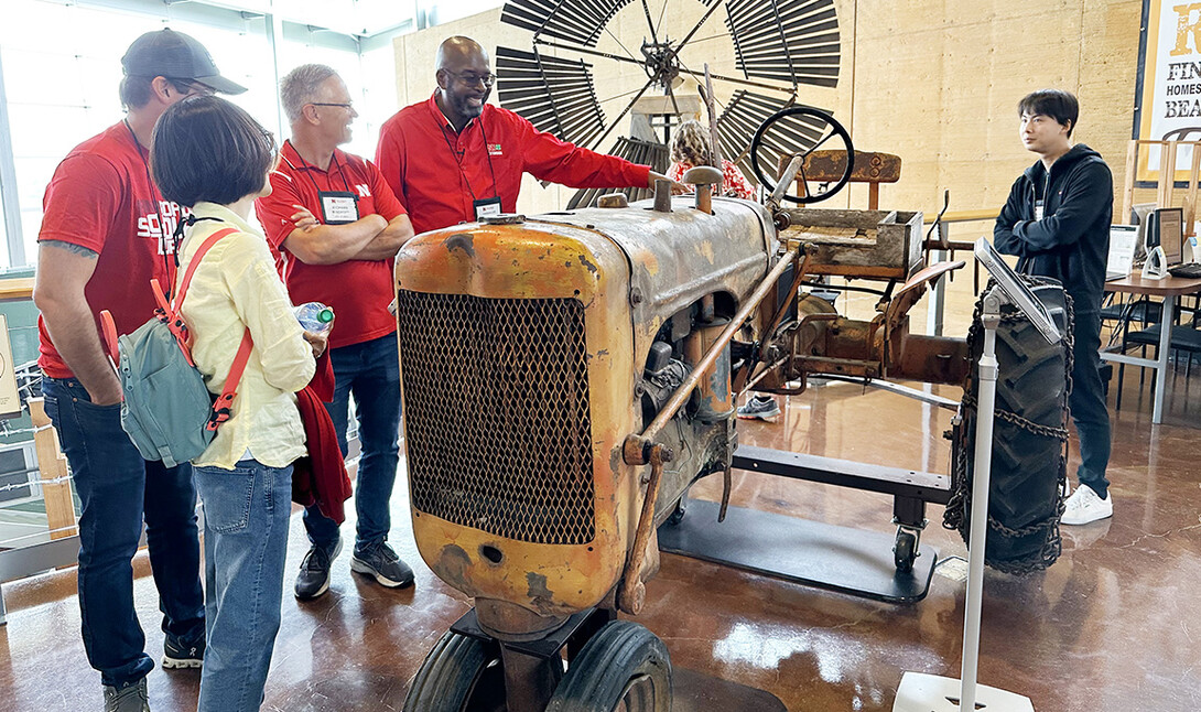 Chancellor Rodney Benefit looks at a tractor used by the last homesteader at Homestead National Historic Park in Beatrice, Nebraska. 