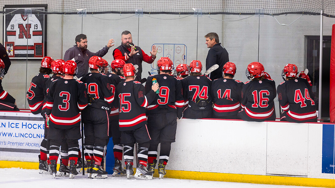 The Husker hockey team meets during its game against Dallas Baptist University Oct. 7.