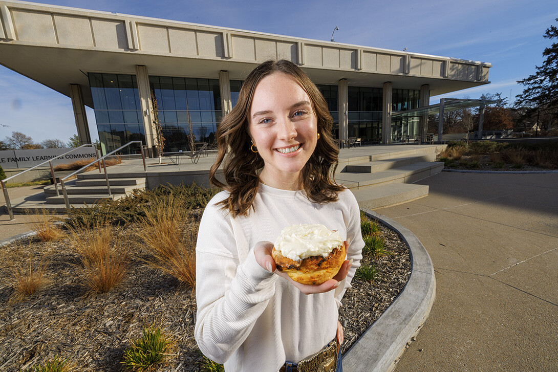 Alexa Carter holds her chili roll creation.