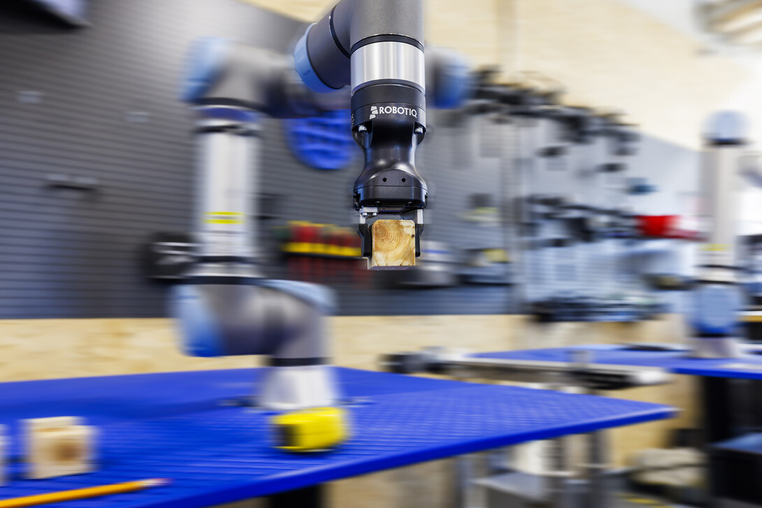 A robotic arm is programmed to stack blocks at Nebraska Innovation Studio.