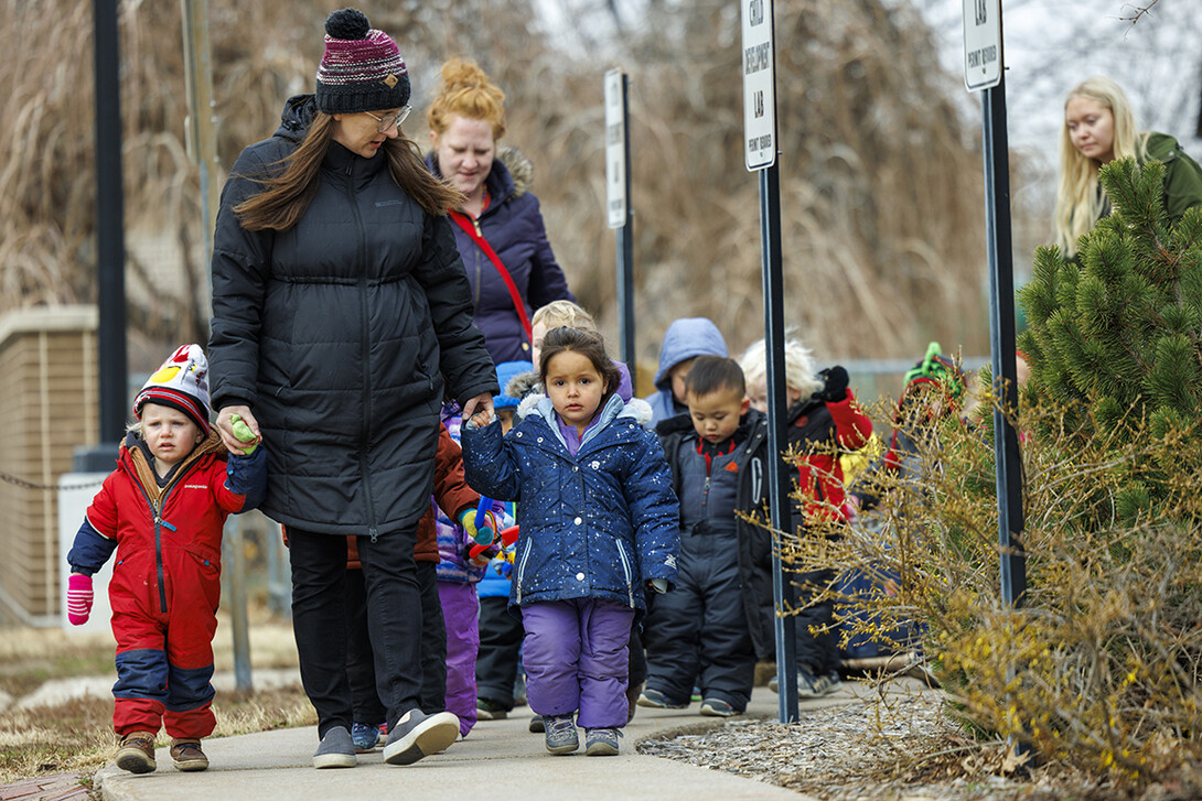 Mollie Von Kampen leads the children on a field trip.