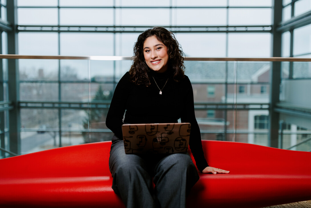 Ritsa Giannakas, a political science and economics major from Lincoln, poses for a photo inside Howard L. Hawks Hall.