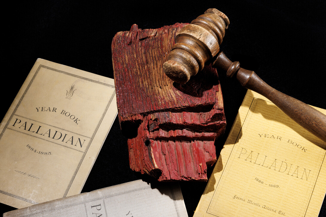The gavel from the Palladian Society sits among other memorabilia.