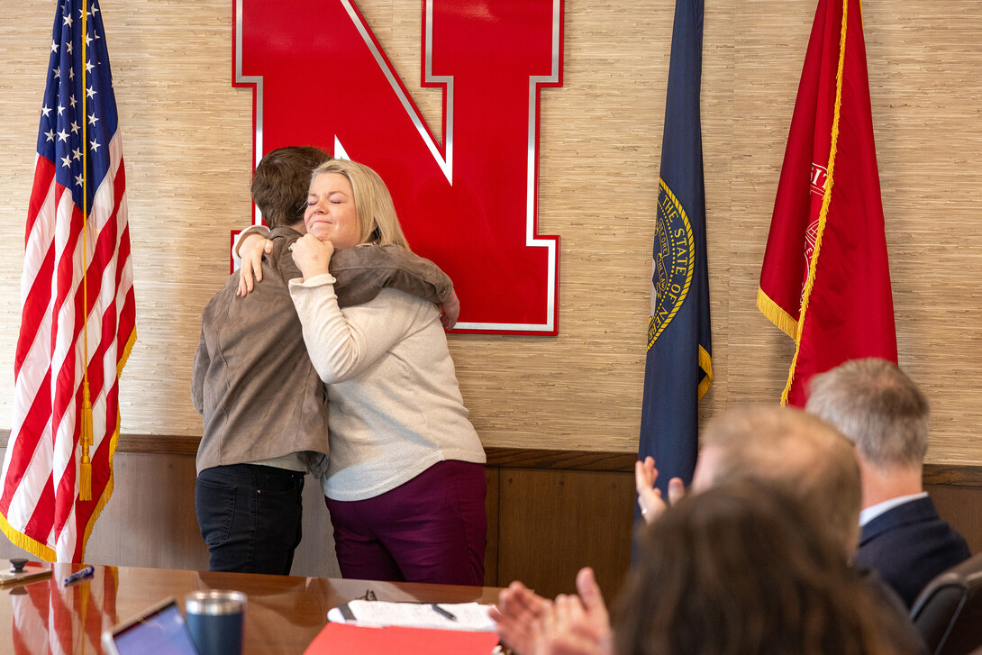 Jessica Herrmann, Director of Government Relations, hugs Luke McDermott after the announcement that McDermott was chosen as a Truman Scholar. Herrmann has mentored McDermott and wrote a letter of recommendation for the award.