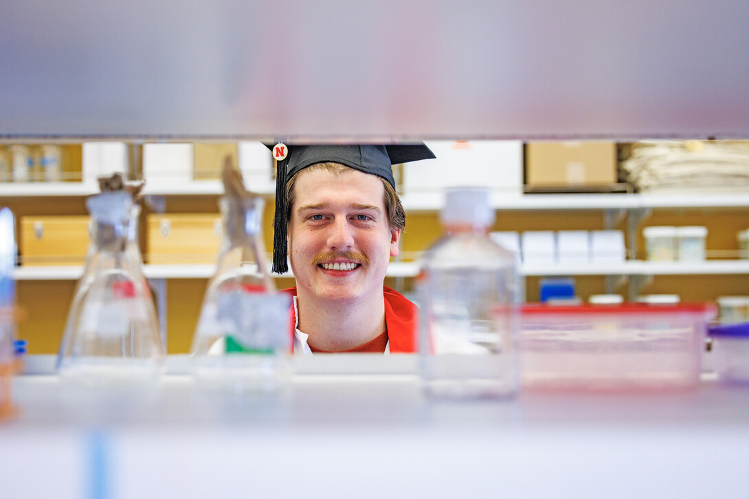 Kai Waddell poses for a portrait at the Morrison Life Sciences Building on East Campus. Waddell is a Microbiology major and is set to graduate this May.