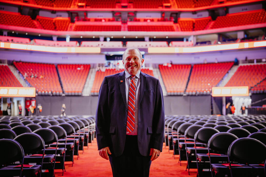 Corrie Svehal takes a photo in Pinnacle Bank Arena, which has been set up for commencement exercises.