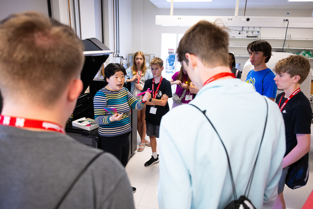Wen Qian, associate professor in the College of Engineering, talks about 3D printing with middle- and high school students in engineering camp, one of the Nebraska 4-H Big Red Summer Academic Camps held during the second week of June.