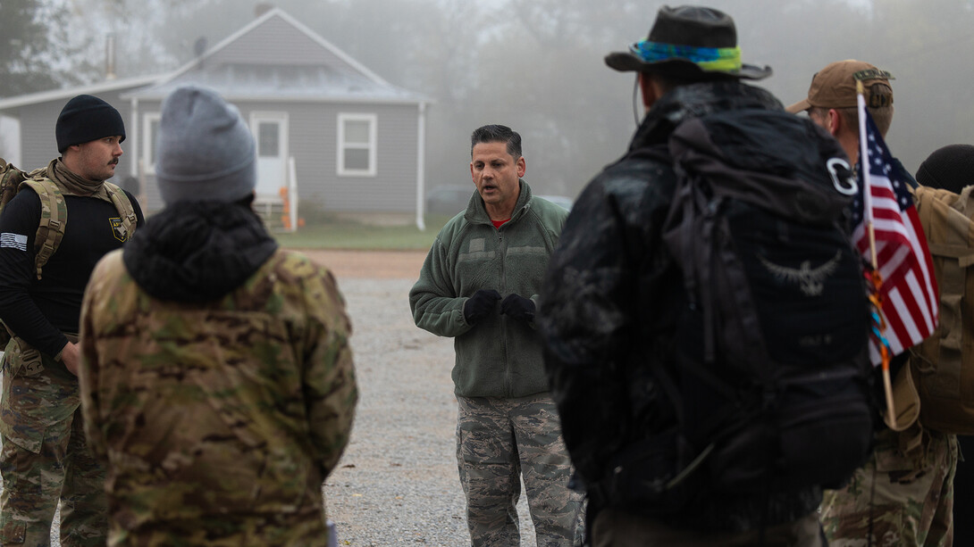 Joe Brownell, executive director of the Military and Veteran Success Center, meets with participants joining the 2025 Ruck March before setting out at 8:15 a.m. from Murdock, Nebraska.