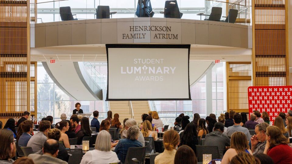 Dr. Laurie Bellow, vice chancellor for student affairs, addresses attendees at the 2023 Student Luminary Award reception in Hawks Hall.