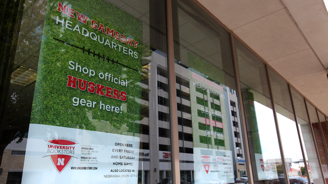 Signs in the building at 13th and Q streets herald the new Husker game day location for the University Bookstore. The store will be open Fridays and Saturdays for home Husker football games.