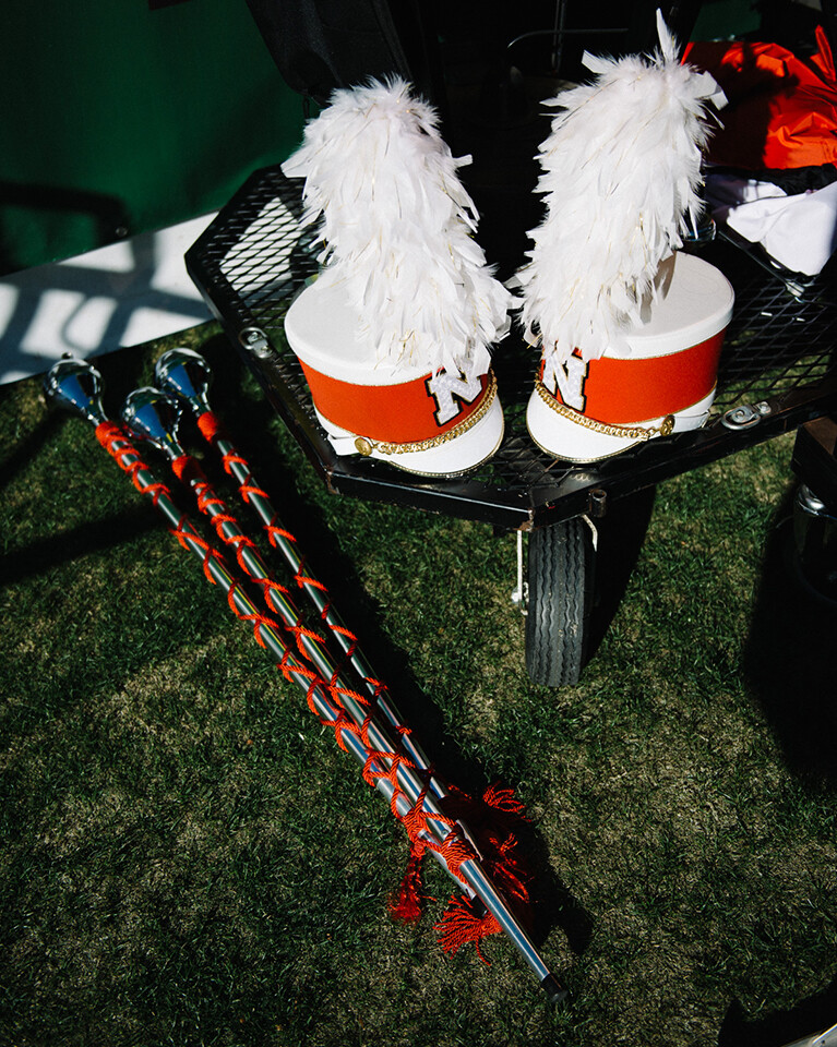 Cornhusker Marching Band maces (left) and shakos (head gear) sit in reserve as the band prepares for a Music City Bowl event.