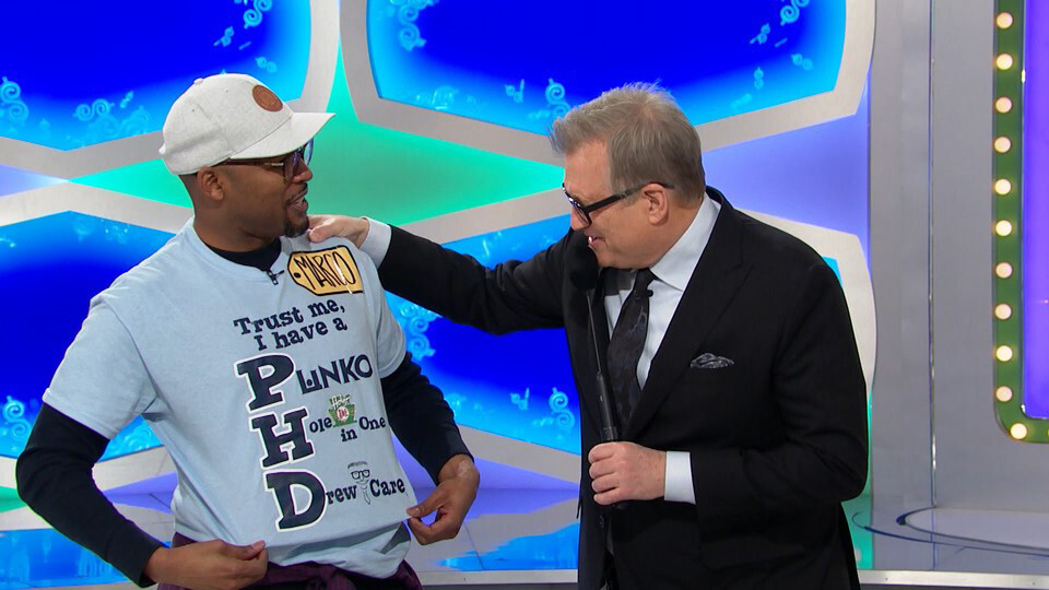 Marco Barker shows 'The Price is Right' host Drew Carey what Ph.D. really stands for.