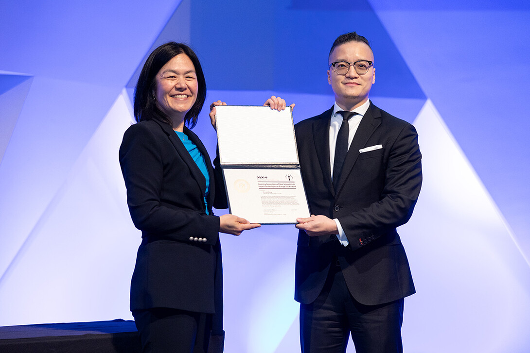 Photo is from ARPA-E ceremony in Washington, D.C. on July 9. Presenting Dr. Wang with his ARPA-E award certificate is ARPA-E director Evelyn Wang.